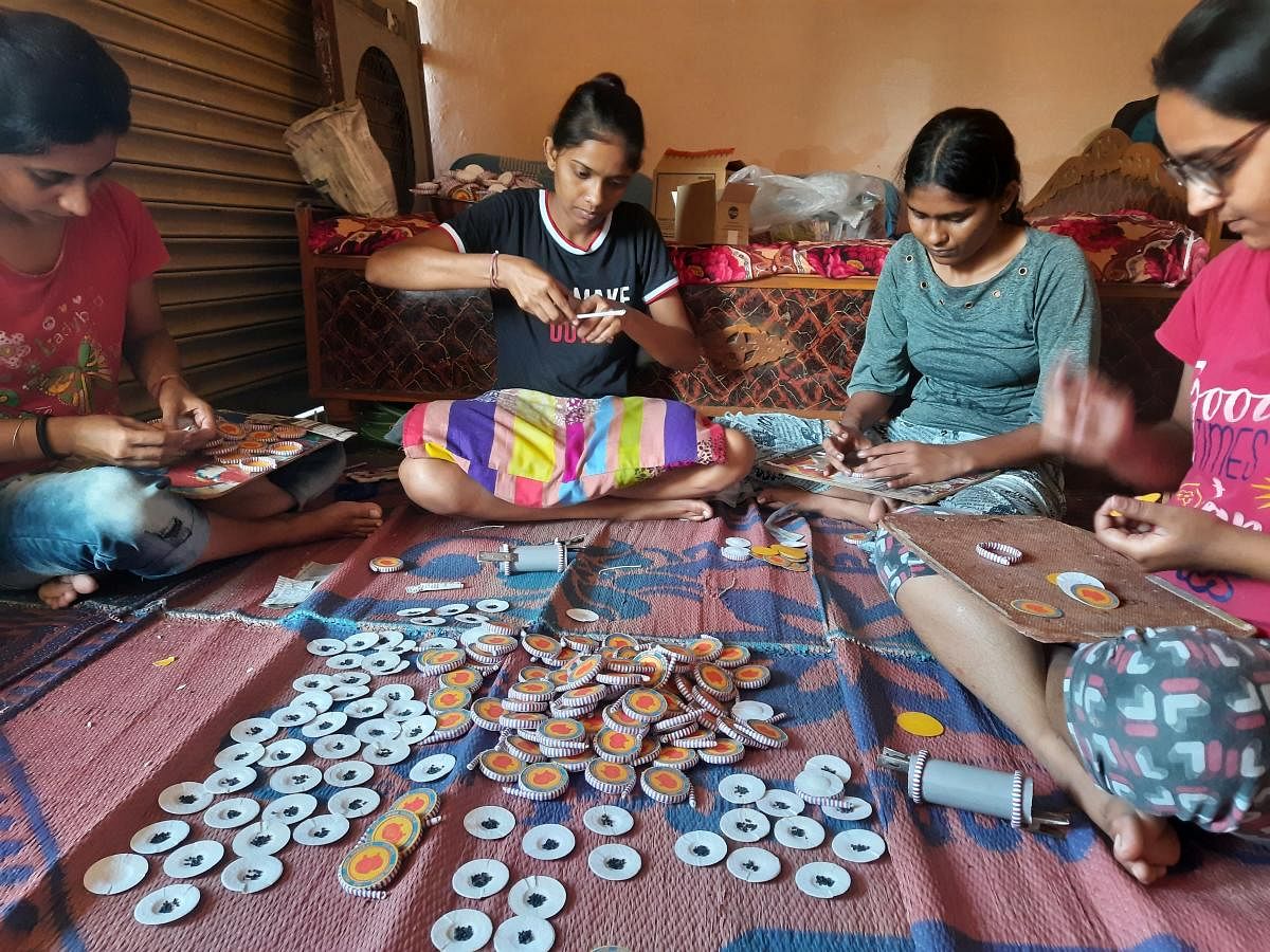 Local women are involved in making the seed firecrackers