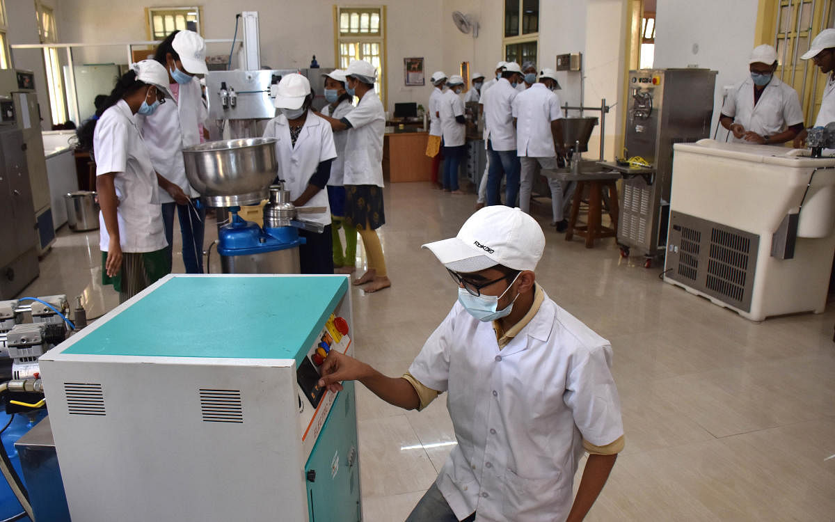 The students at work in their classroom-cum-business at the Dairy Science College in Hebbal, Bengaluru; (below) different dairy products launched by the students. Credit: DH Photo/BK Janardhan