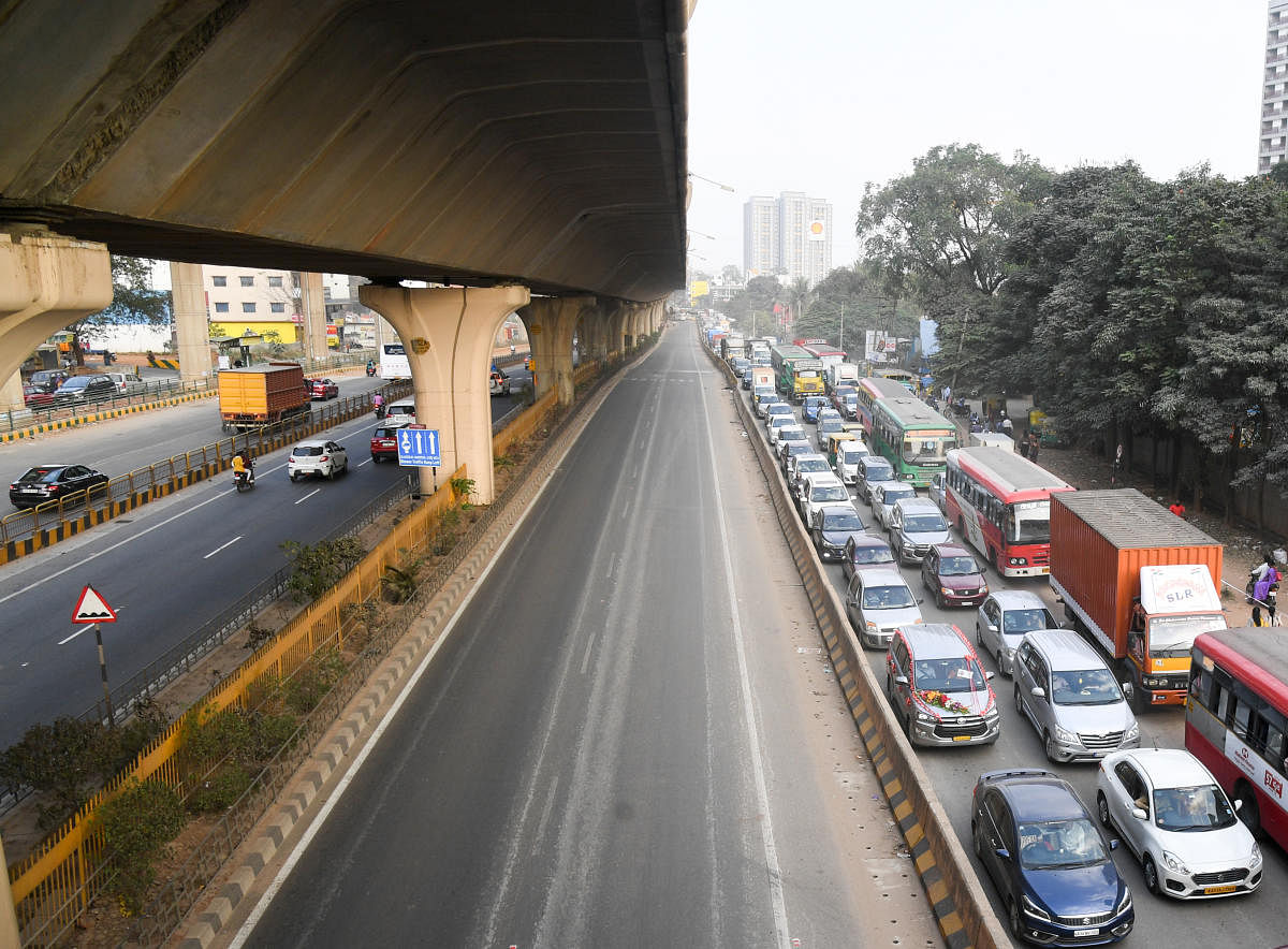 The main highway below the Peenya flyover was closed to traffic on Sunday. The NHAI is still repairing the flyover, which has stayed shut since December 25. DH PHOTO/B H SHIVAKUMAR