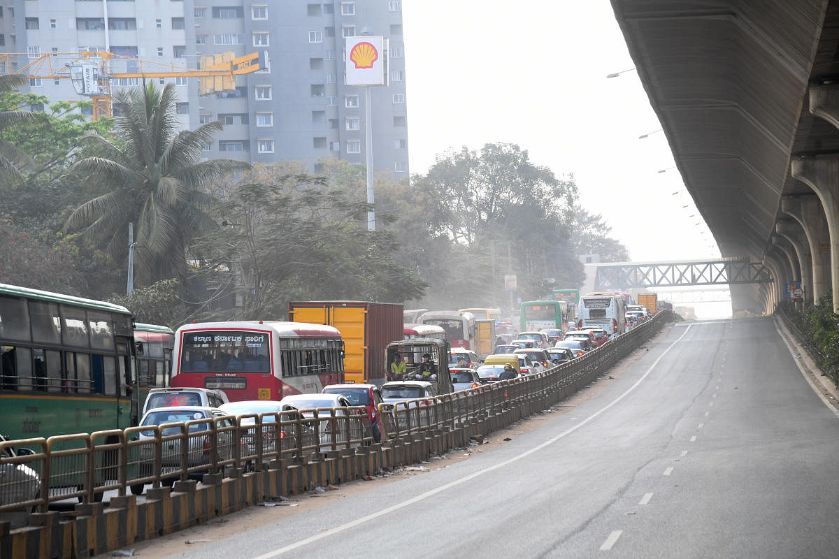 The main highway below the Peenya flyover was closed to traffic on Sunday. The NHAI is still repairing the flyover, which has stayed shut since December 25. DH PHOTO/B H SHIVAKUMAR