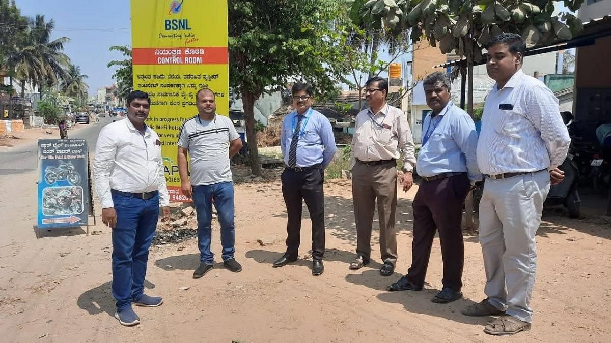 Director, Consumer Fixed Access, BSNL, Vivek Banzal launches WiFi services under Public Data Office at Rammanahalli on the outskirts of Mysuru recently. BSNL Chief General Manager Devesh Kumar and Senior General Manager Rajkumar are seen. Credit: DH Photo