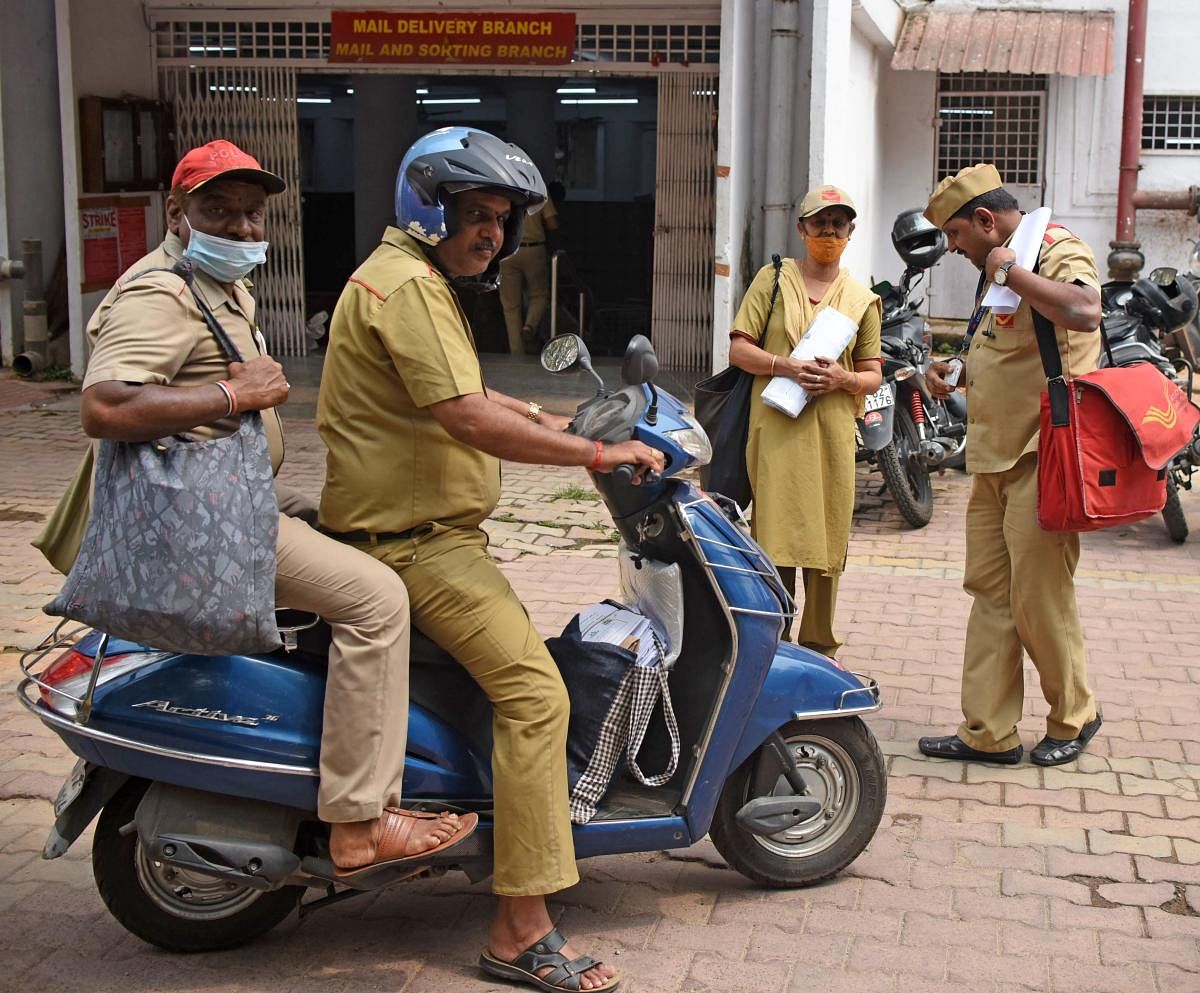 After the letters are sorted into beats, the post delivery men and women get ready to make sure the letters reach their destination. Credit: DH Photo