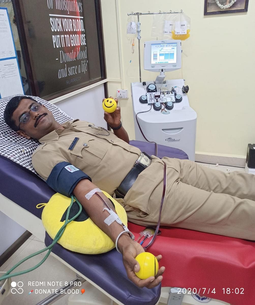 A blood donation camp conducted in a police station in Akkialur. Credit: DH Photo