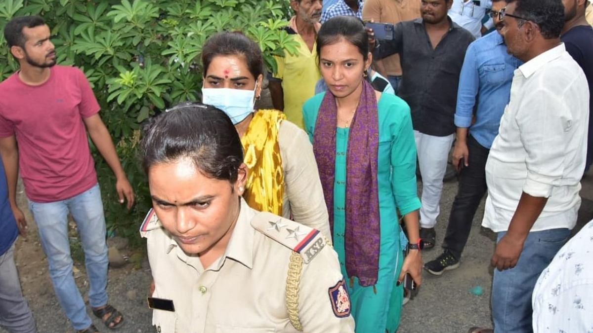 The CID sleuths bring Divya Hagaragi, one of the suspects in the PSI job scam, to her house for mahazar in Kalaburagi on Sunday. Credit: Special Arrangement