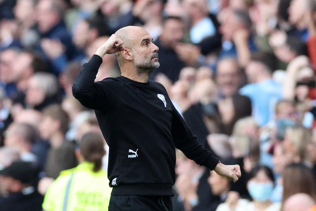 Premier League - Manchester City v Newcastle United - Etihad Stadium, Manchester, Britain - May 8, 2022 Manchester City manager Pep Guardiola celebrates after Raheem Sterling scores their first goal. Credit: Reuters Photo