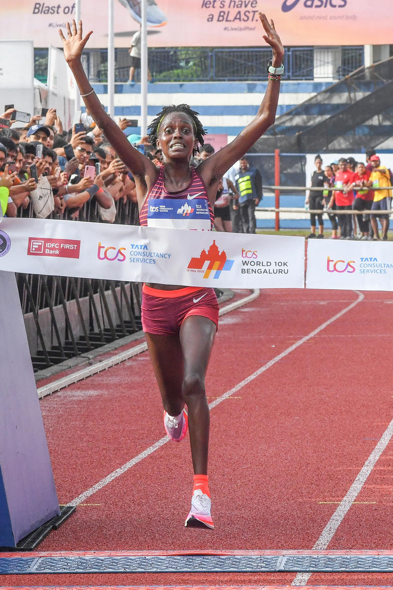 Nicolas Kipkorir (Above) and Irene Cheptai, both from Kenya, celebrate after winning the men's and women's International Elite men's and women's races respectively at the TCS World10K in Bengaluru on Sunday. Credit: DH Photo