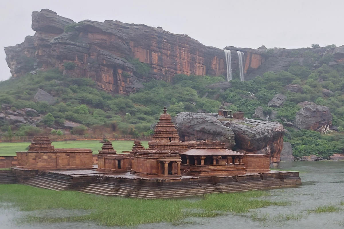 The rain-soaked Bhoothnath Temple, Agasthyatheertha pond and the famed Akka-Tangi waterfall in the backdrop present a breathtaking view, in Badami on Thursday. Credit: DH Photo