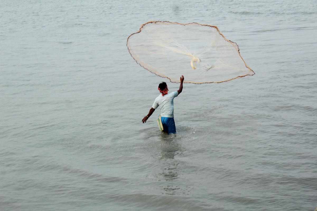 A fisherman casting a net