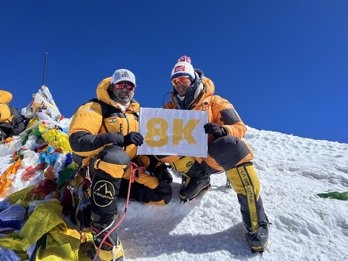 Bengaluru's 49-year-old Sunil Nataraj with his Nepali guide Tsering Pemba sherpa on top of the Mt Everest. Credit: Special arrangement