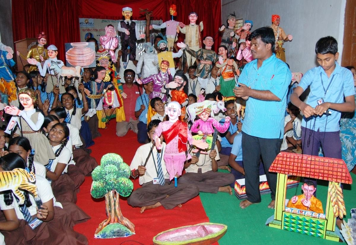 Children playing and learning through puppets