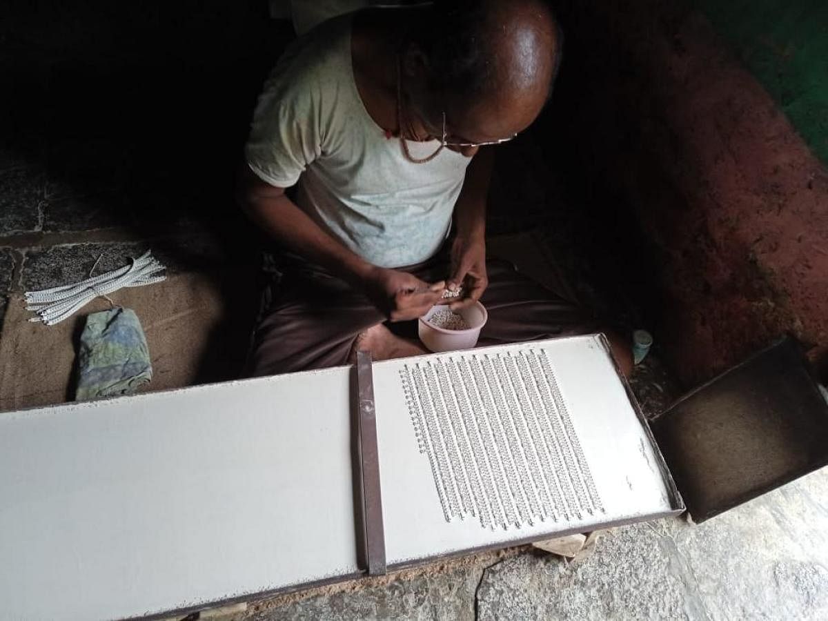 Artisans in Manguru village, Belagavi district working on silver anklets. Photos by author 