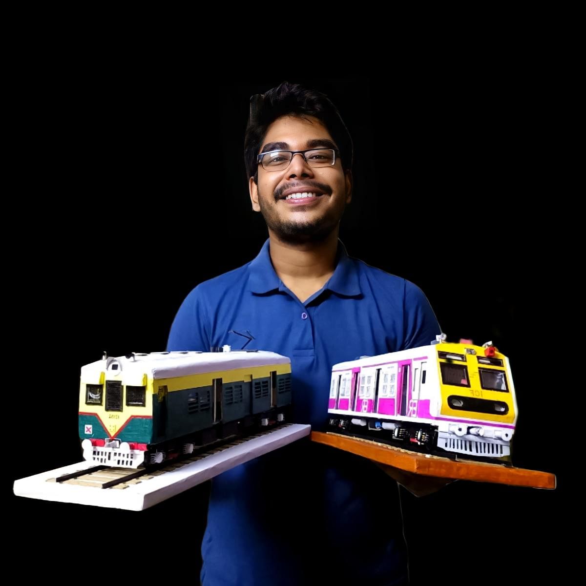 Sayan Basak with models of train coaches.
