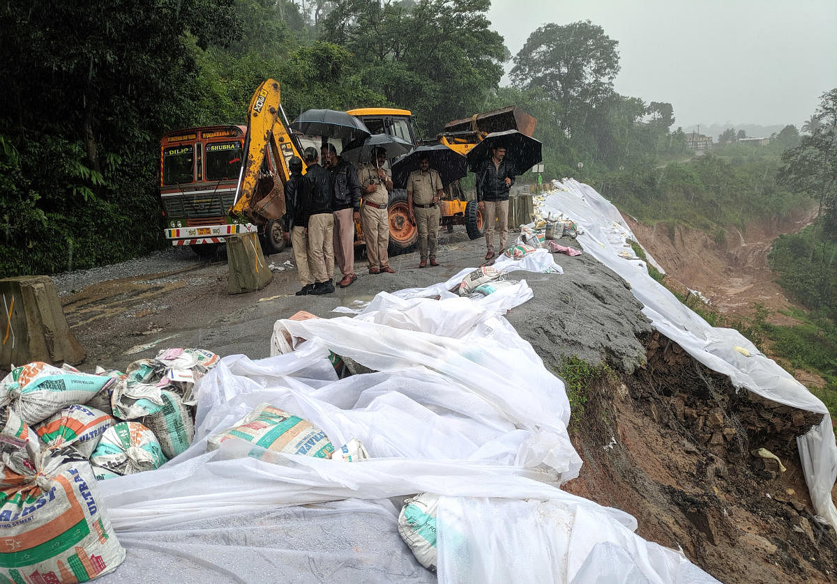 Landslide near Donigal on Bengaluru-Mangaluru highway has affected the movement of vehicles. DH Photo/Janekere R Paramesh