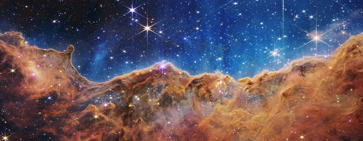‘Cosmic Cliffs’ in the Carina Nebula captured by the near-infrared cameraon NASA’s Webb Telescope (Pic courtesy: Space Telescope Science Institute) 