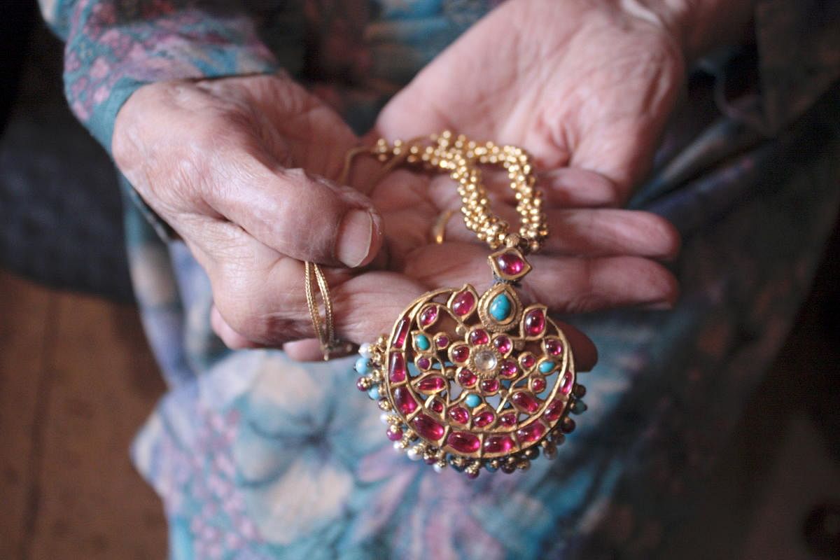 Maang-tikkaThis family jewellery is over 100 years old, made of stones found in the then North-West Frontier Province. Author's grandmother carried it along with the hope of selling it to pay for the education of her children. Credit: DH Photo