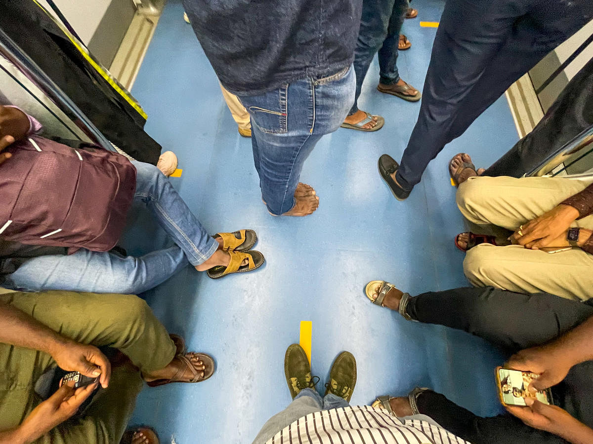 (From left) The reporter walked barefoot inside a Namma Metro coach and at K R Market and Cubbon Park. Credit: DH Photo
