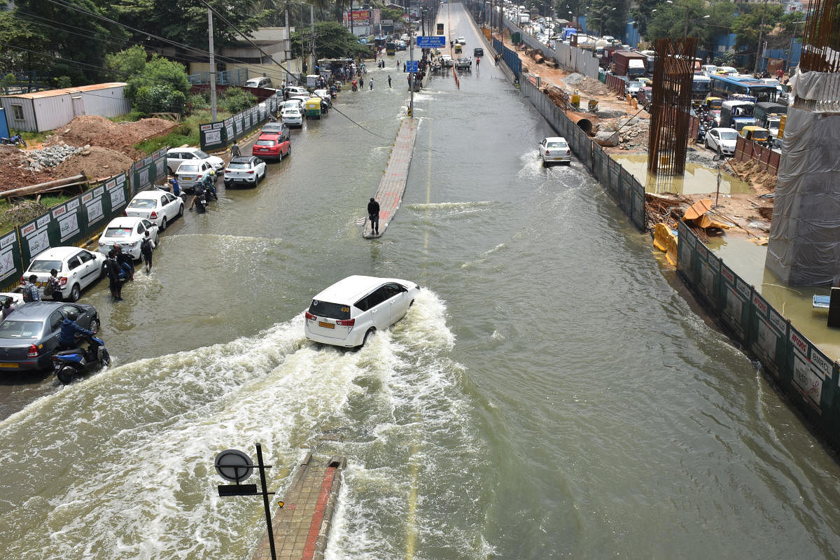 A waterlogged Marathahalli Ring Road on Tuesday morning. Credit: DH Photo/B K Janardhan
