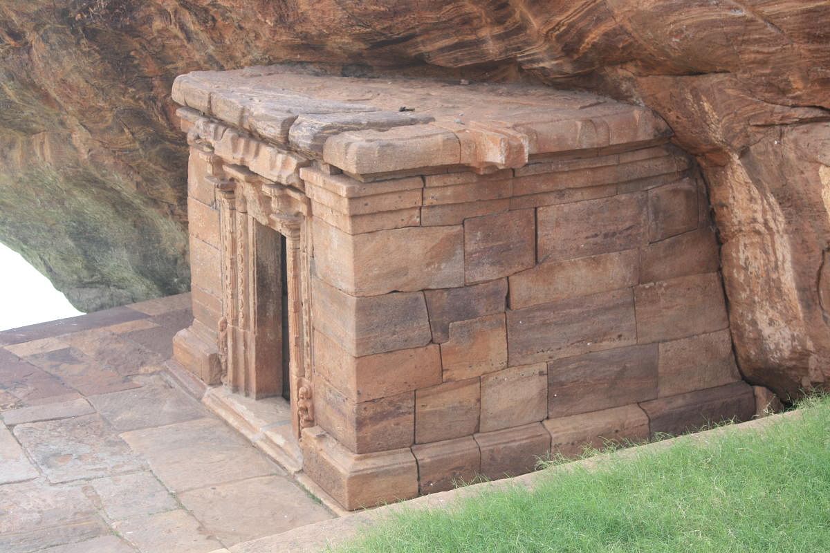 A small shrine enclosing the image of Anantashayi Vishnu, carved on the base of the boulder.
