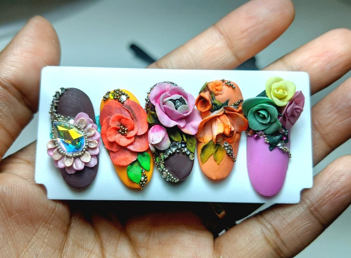 These nails by Ruchita Mhatre have 3D nail flower toppers on them. Credit: Special arrangement
