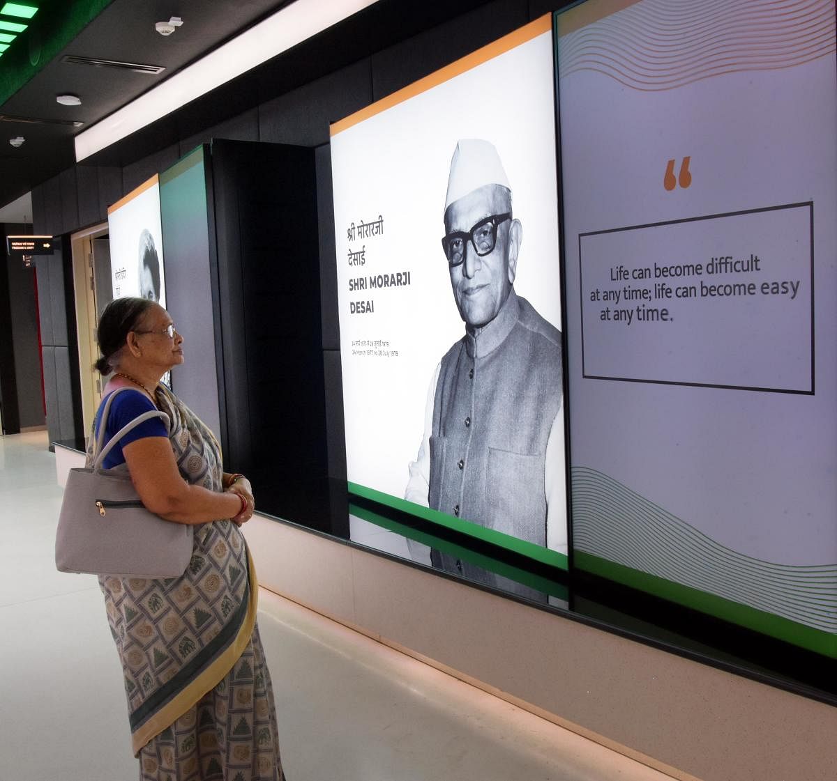 A visitor reads what Morarji Desai has to say