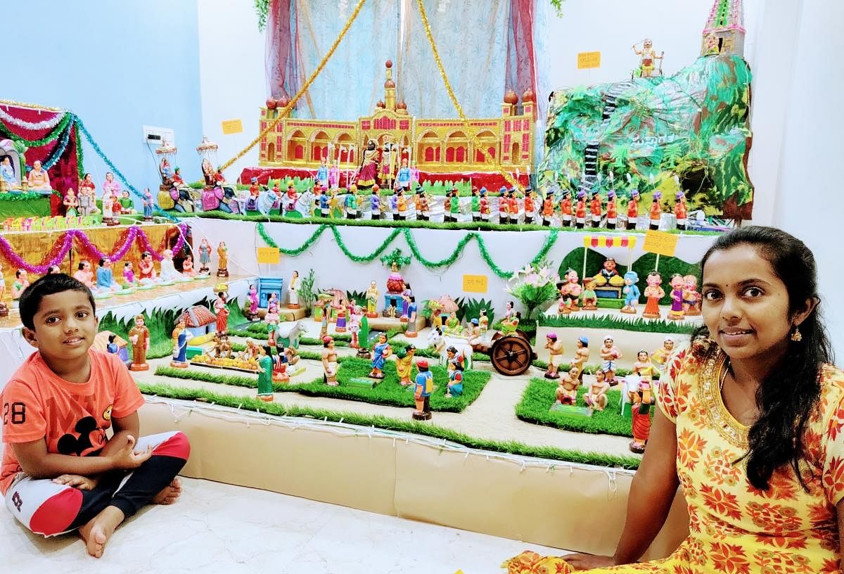 Krupa Sunil and son Amarthya have set up a display that depicts the Mysuru Dasara, Chamundi Hills and village life.