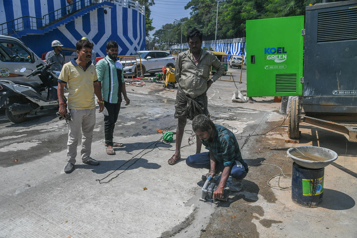 Road repairs under way near Palace Grounds. DH PHOTO/S K DINESH