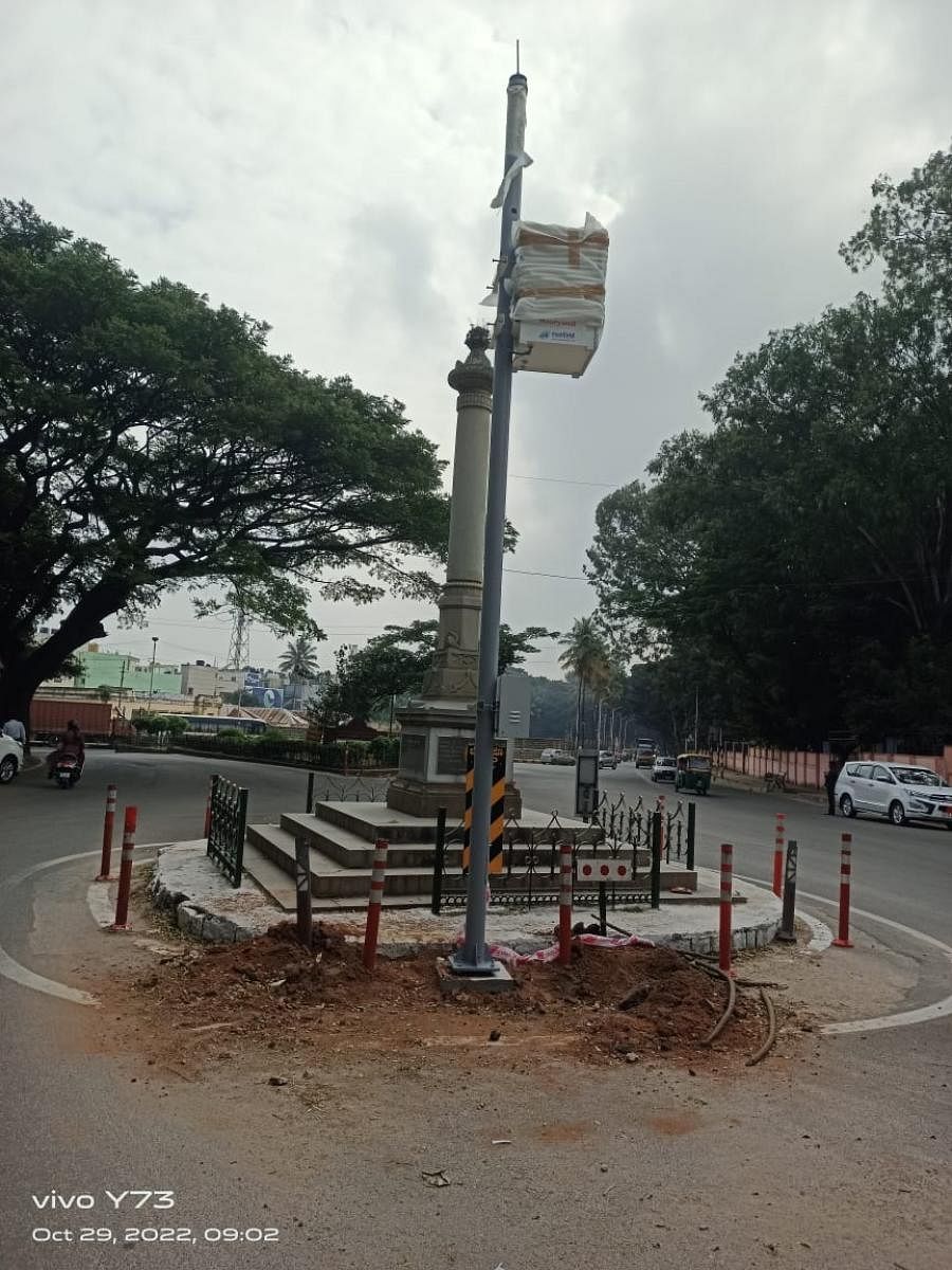 Police authorities on Sunday removed the CCTV camera pole they had erected right next to the war memorial in JC Nagar. Credit: DH Photo