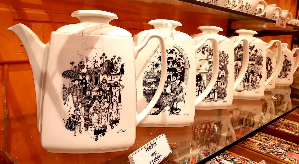 Teapots with the cartoonist’s works.