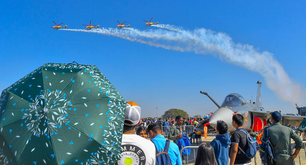 A team of Sarang helicopters perform at the show. Credit: Prajavani Photo