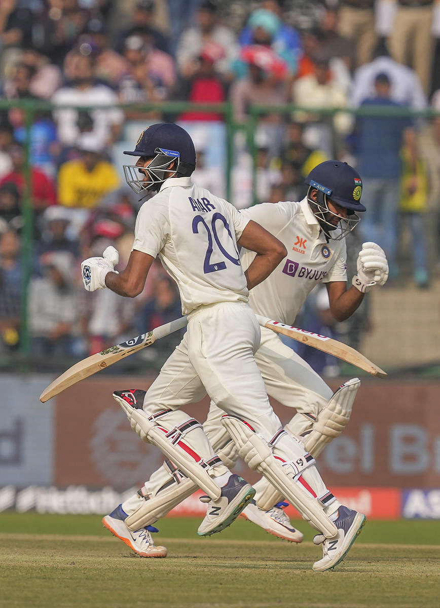 Indian batters Axar Patel (left) and Ravichandran Ashwin run between the wickets during the second Test between India and Australia at the Arun Jaitley Stadium in New Delhi. Credit: PTI Photo