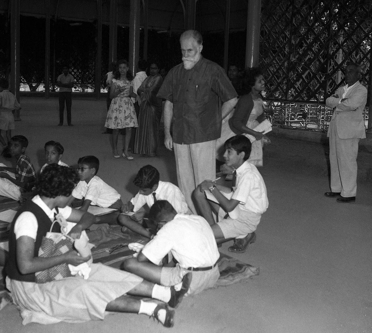 Veteran painter Nikolas Rorich observes children engaged in on the spot painting contest organised Junior Chamber of Commerce at Lalbagh Glass house in Bangalore_10-11-1963Svetoslav Roerich Photos.