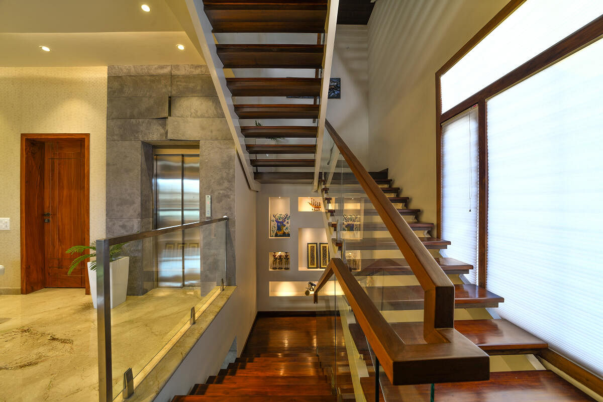 A stairway design by A360 Architects, Bengaluru. The mid-landing features wall niches to display art.