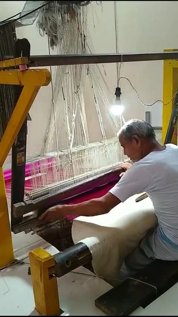 Rahmatullah Khan, a handloom weaver in Sarnath, is one of the weavers employed by Saquib Khan, a trader in Varanasi.