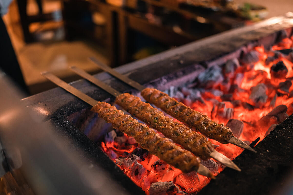 Slow-cooking of kebabs. PHOTO COURTESY THE SHERATON GRAND, BENGALURU