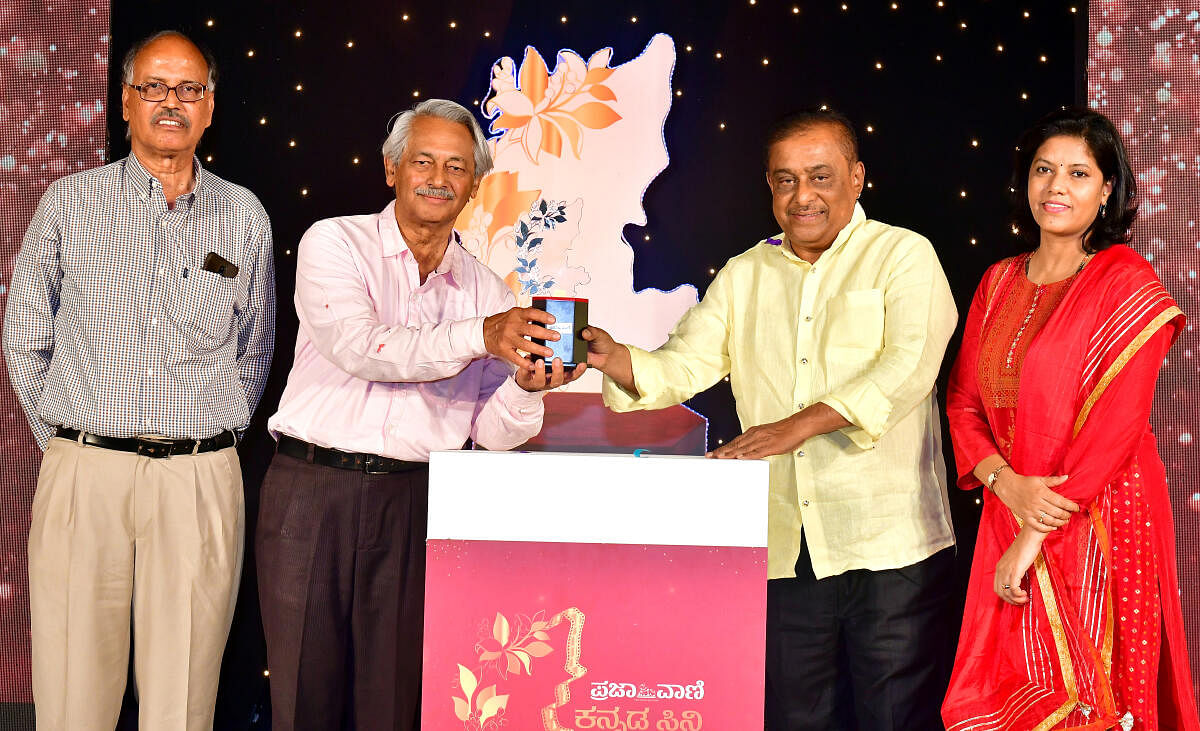 N Vidyashankar, Girish Kasaravalli, Hamsalekha and Sumana Kittur at the unveiling of the ‘Prajavani Cine Sammana’ trophy. PV Photos by KRISHNAKUMAR P S