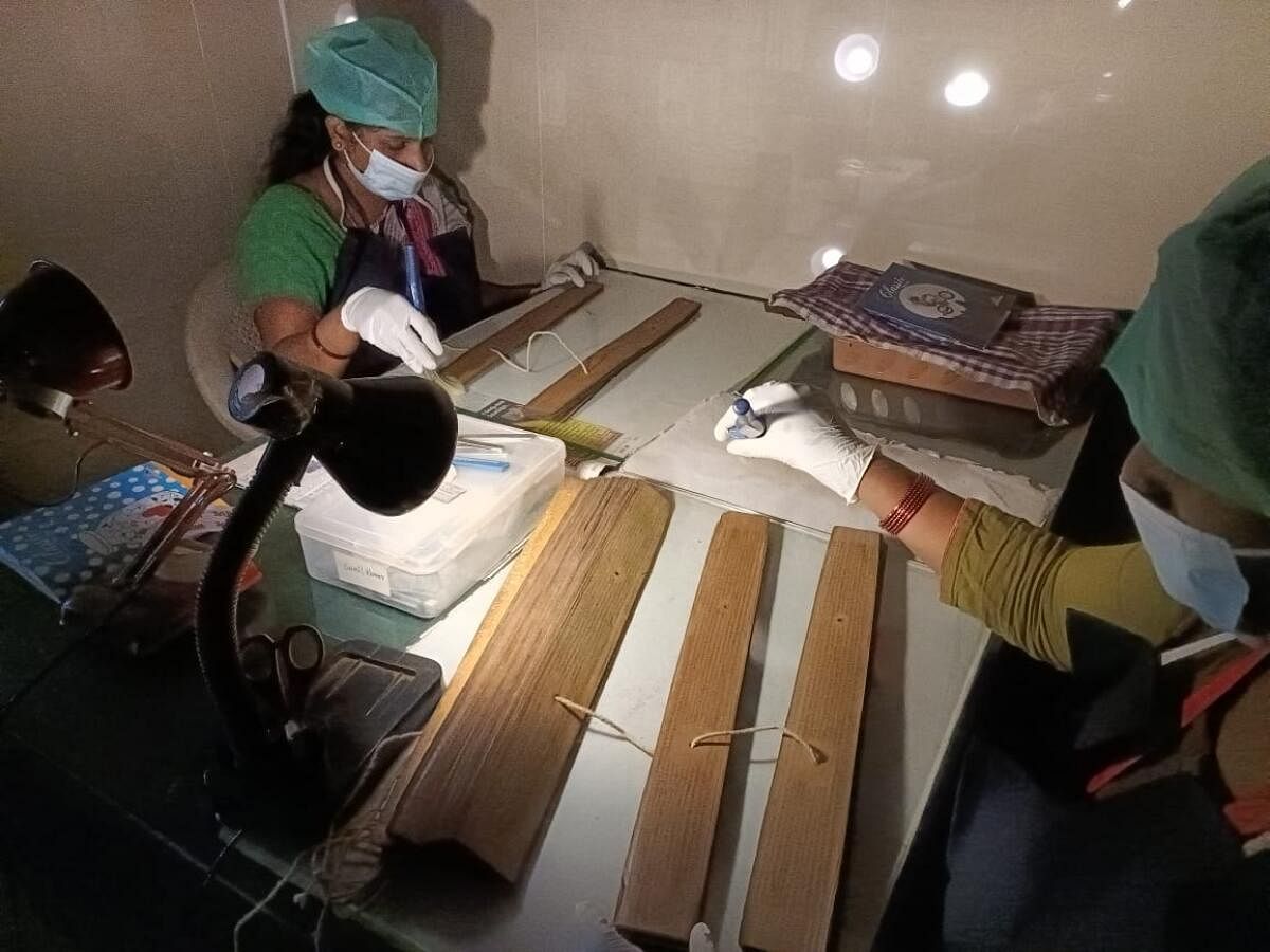The team working on preserving manuscripts at the Oriental Research Institute, Mysuru. Photos by Rohit Eswar