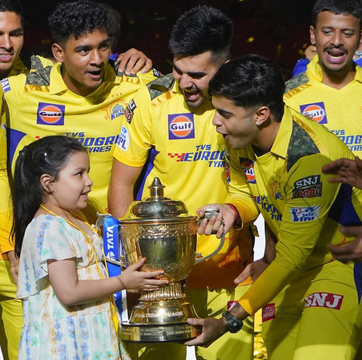 Chennai Super Kings players are joined by skipper M S Dhoni's daughter Ziva as they celebrate their win. Credit: IANS Photo