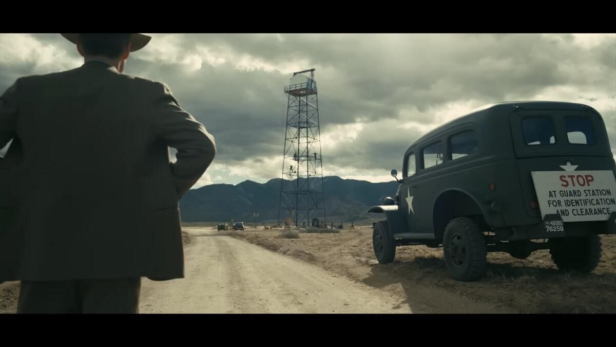 A still from ‘Oppenheimer’, where Cillian Murphy who plays J Robert Oppenheimer, is seen looking at the atomic bomb tower.