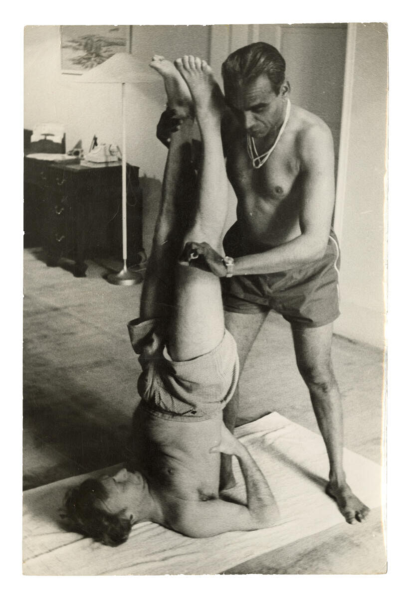 Yehudi Menuhin being taught the Shirashasana byB K S Iyengar, New Delhi 1964.