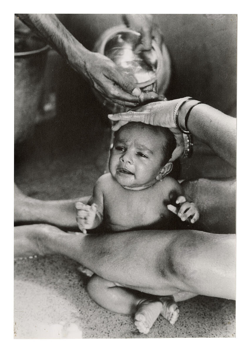 An infant gets an 'oil bath', 1961