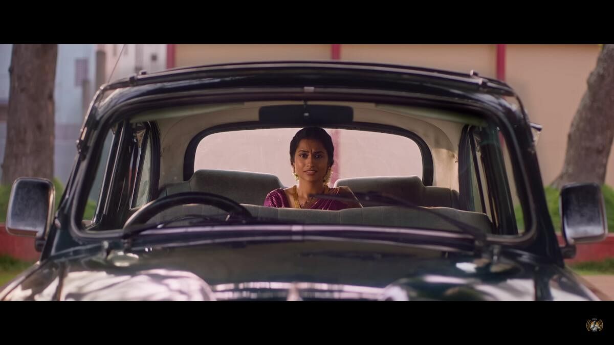 Symmetrical framing as seen in this scene from ‘Aachar & Co.’ is a fixture to Wes Anderson films.