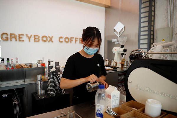 A barista prepares at coffee at a Greybox Coffee store in Beijing, China. Credit: Reuters