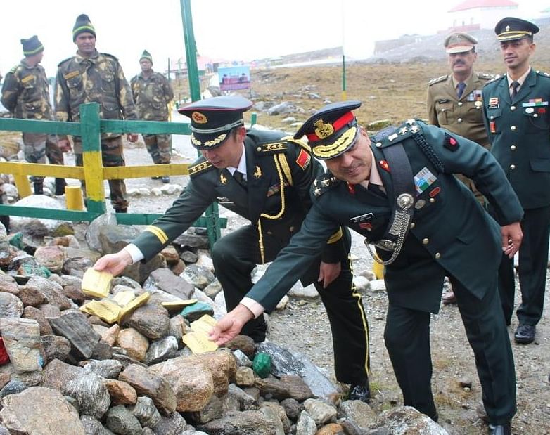 India and Chinese army officers touching the LAC in Arunachal Pradesh on Tuesday. (Photo credit: Indian army)