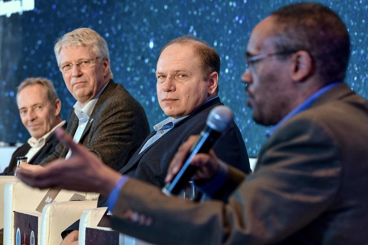 Astronauts General Jean-Francois Clervoy of France (L), Thomas Reiter from the European Space Agency (ESA) of Germany (2L), Dr. Oleg Kotov from the Institute of Biomedical Problems (IBMP) of Russia (2R), and Alvin Drew from National Aeronautics and Space Administration (NASA) of the USA (R), take part in a panel discussion with astronauts at the symposium on Human Spaceflight and Exploration - Present Challenges and Future Trends in Bangalore organised by Indian Space Research Organisation (ISRO). (AFP Photo)