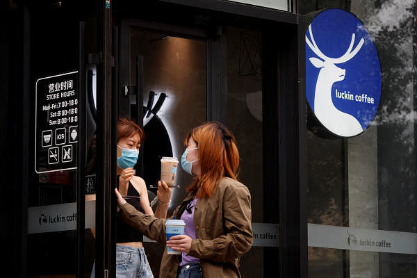 Women leave a store of the Chinese coffee house chain Luckin Coffee in Beijing, China. Credit: Reuters