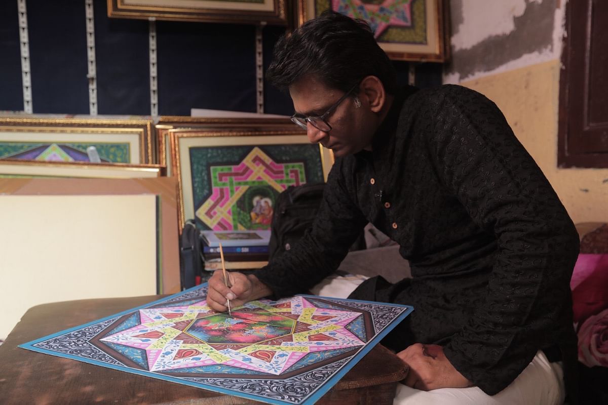Sumit Goswami making a sanjhi artwork. Credit: Sumit Goswami