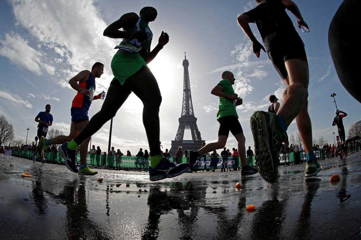 Runners make their way past the Eiffel Tower as they participate in the 42nd Paris Marathon, in France. Reuters Photo