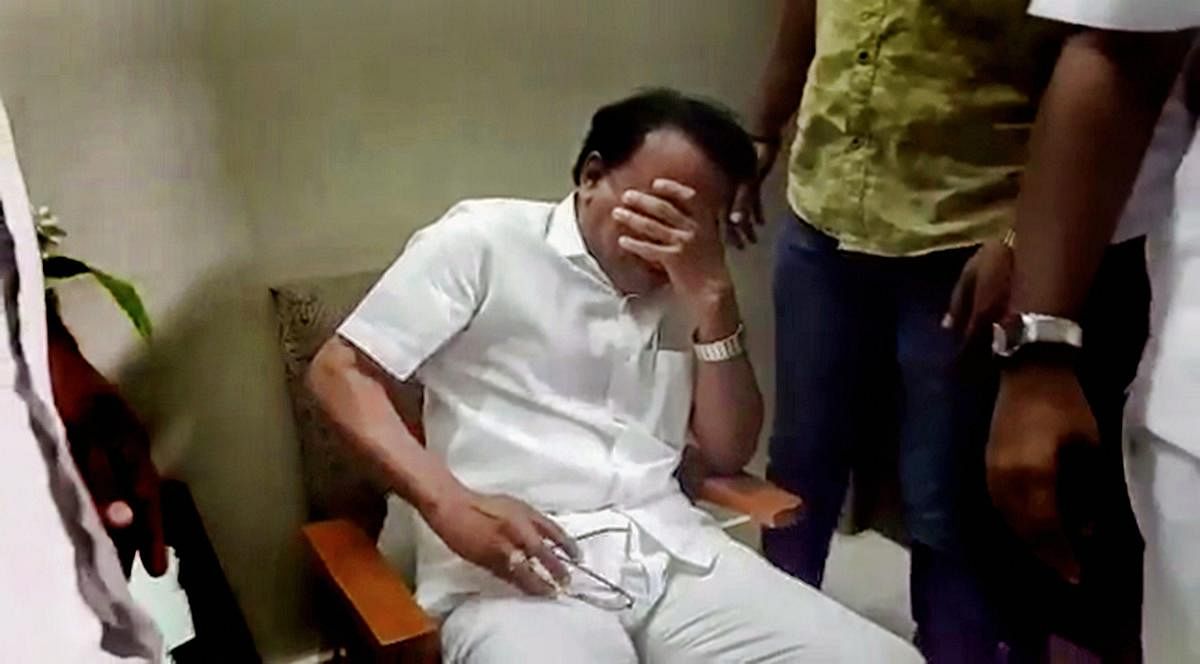 Former BJP MLC Shashil G Namoshi breaks down in front of the media after release of the BJP list of candidates in Gulbarga, Karnataka on Monday evening. PTI / Video Grab