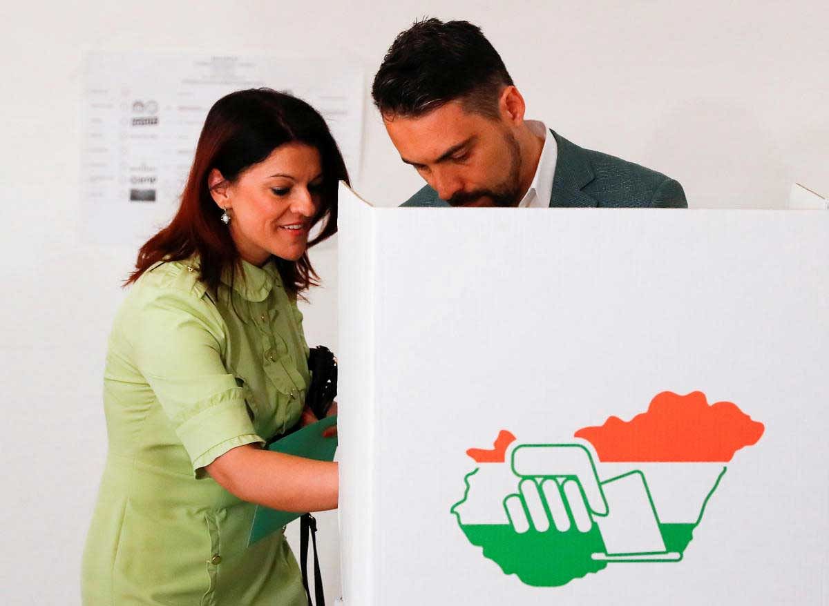 Jobbik party leader Gabor Vona, main opponent to current Prime Minister Viktor Orban and his wife Krisztina Vona-Szabo leave a polling booth to cast their ballots during Hungarian parliamentary election in Gyongyos, Hungary. Reuters Photo
