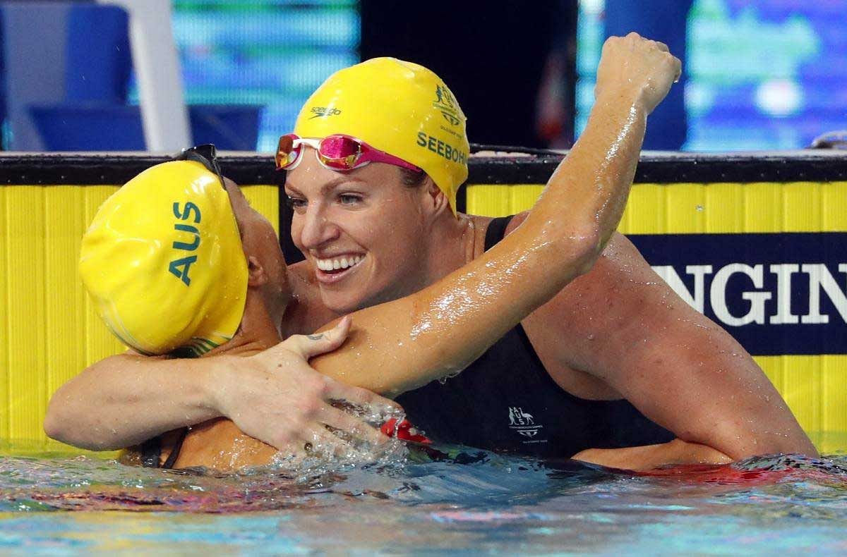 Swimming: Emily Seebohm and Holly Barratt of Australia hug. Reuters Photo